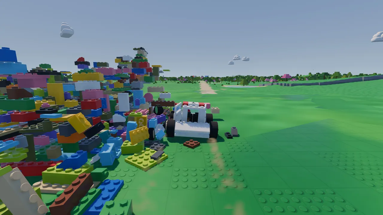 A white brick buggy ploughing into a heap of colourful bricks.
